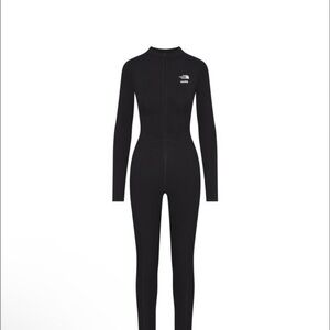 Skims north face bodysuit in black size XS i bought off here and paid $350
